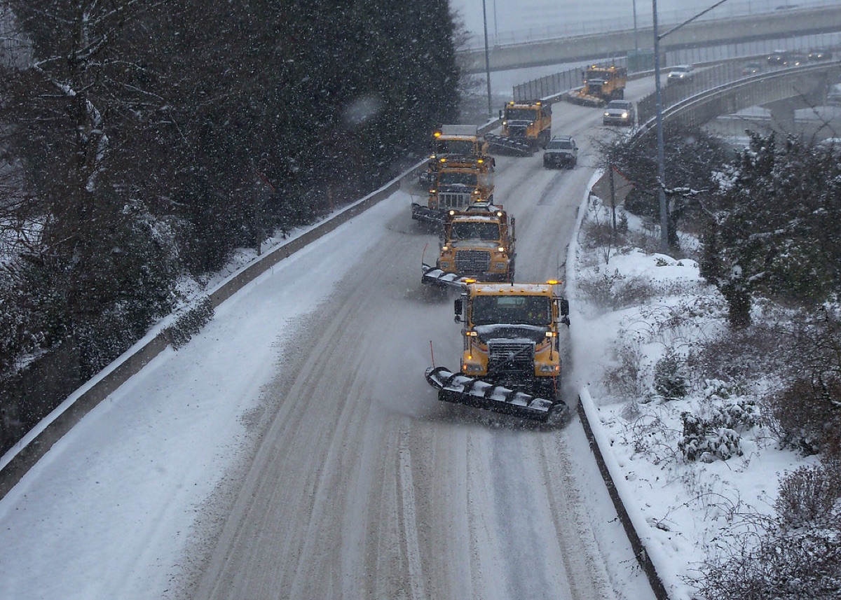 snowplow truck on highway during winter