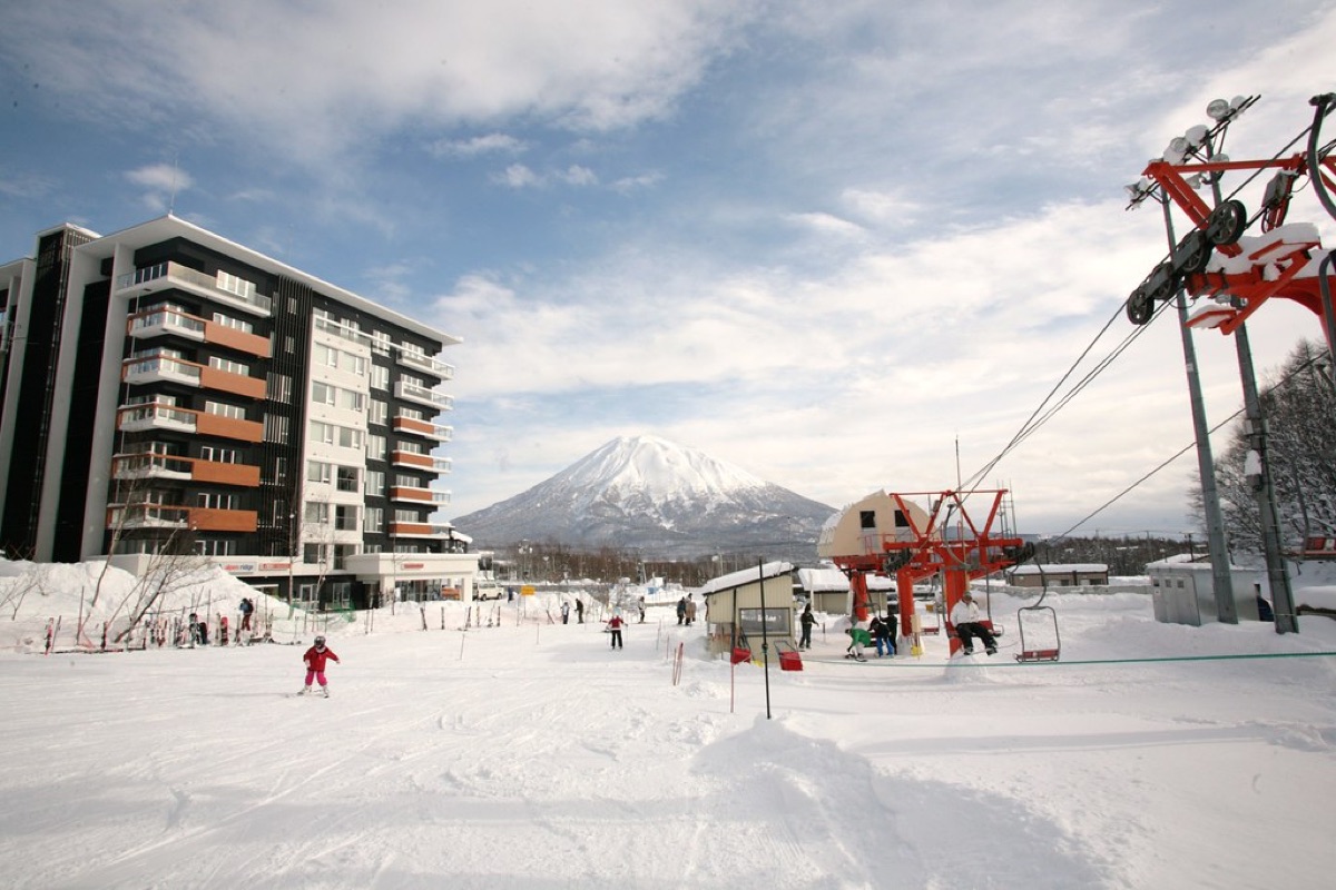 luxury resort in hokkaido with hot spring bath and snow-covered landscape