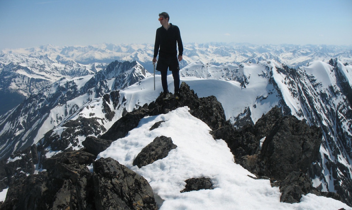 Snowy mountain peak with hiking trail